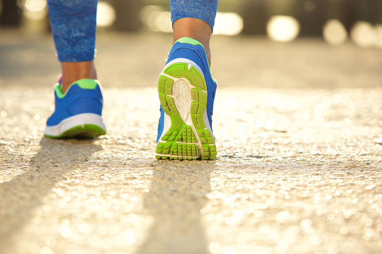 An adult running shoe poised for physical activity to boost their wellbeing.