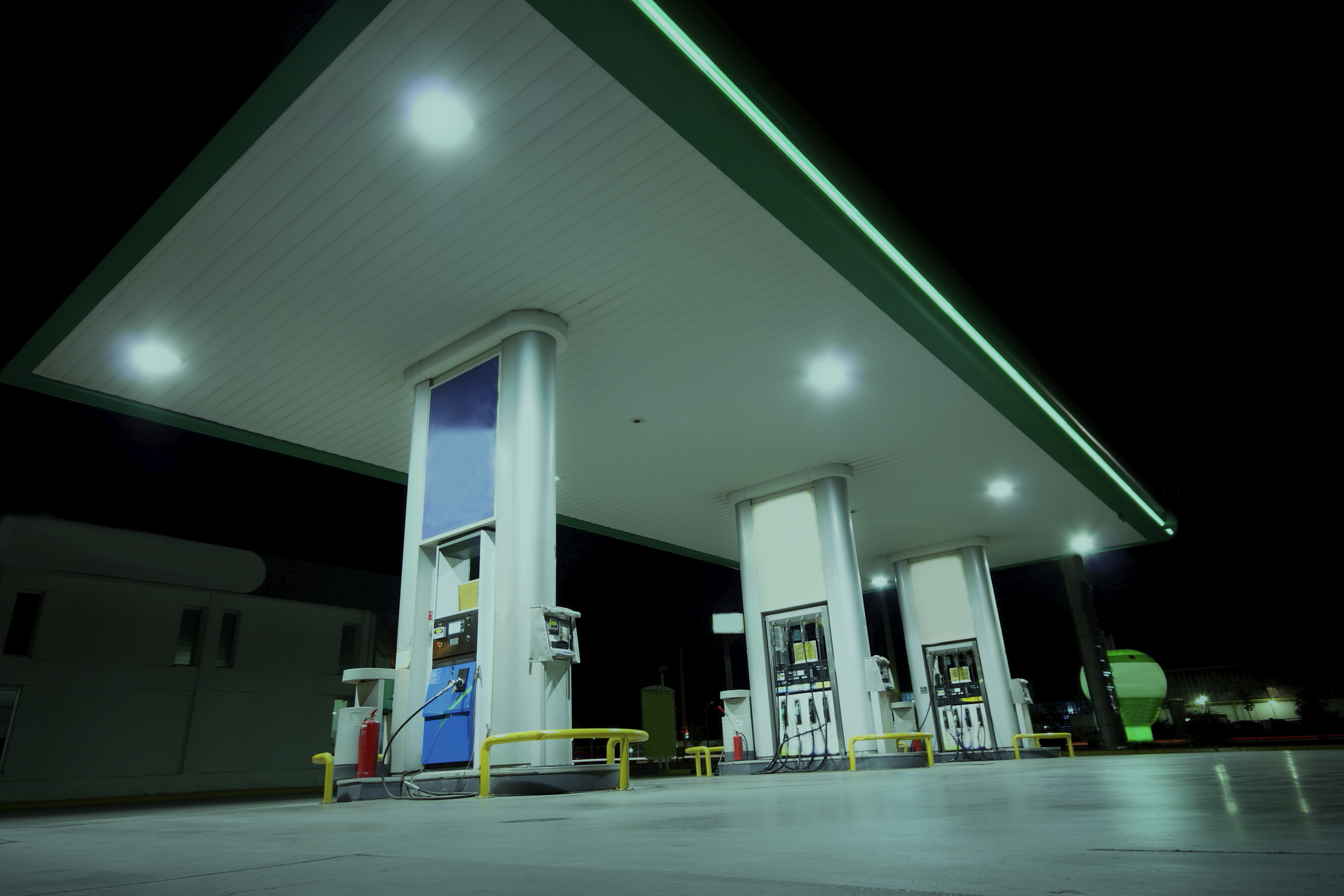 Petroleum gas station pumps at night