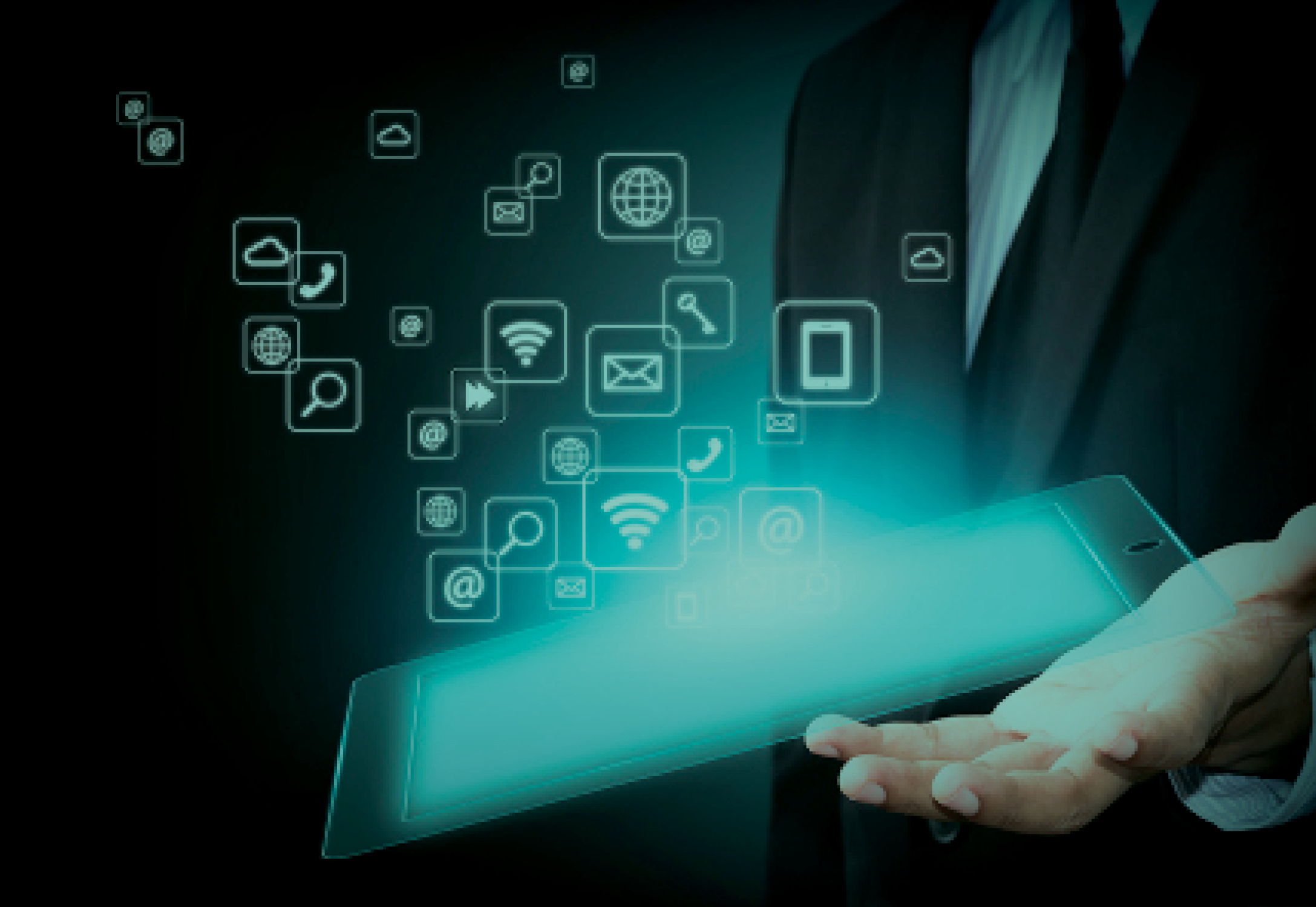 A tablet glowing in a person's hand with data and icons flowing into the air.