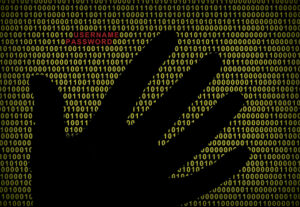A hand in front of a computer screen with code. In red is username and password.