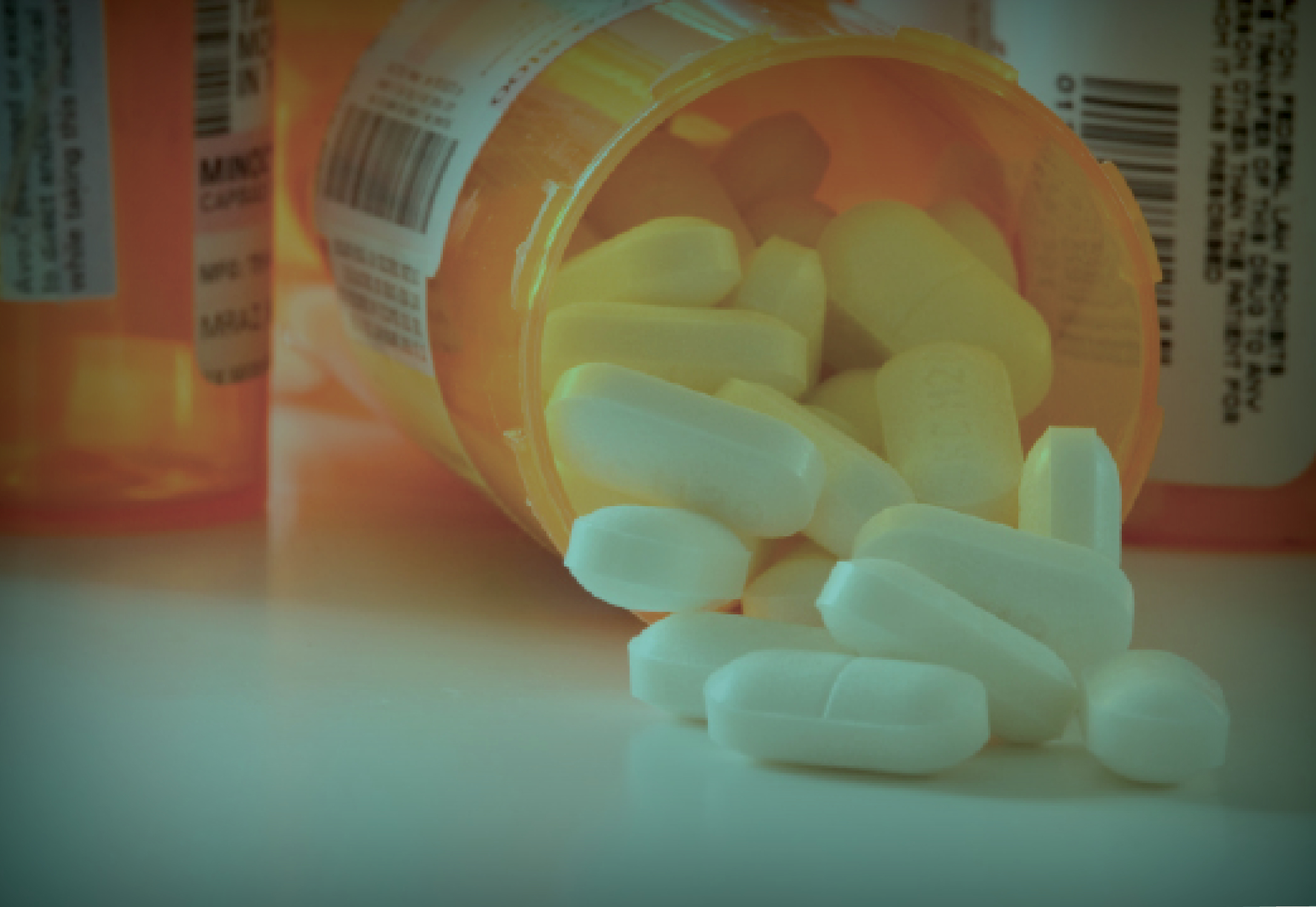 A bottle of prescription drugs tipped onto its side