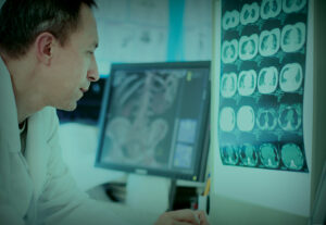 A healthcare professional looking at X-Rays.