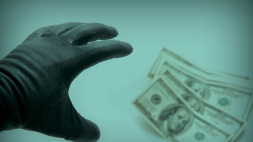 A hand reaching for money and increasing your risk
