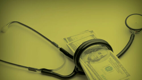 a wad of money encircled by a healthcare instrument