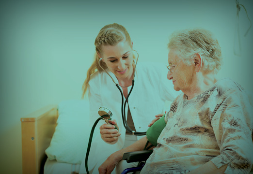 A healthcare provider caring for an older person