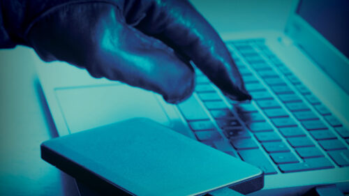 A hacker committing cyber crime