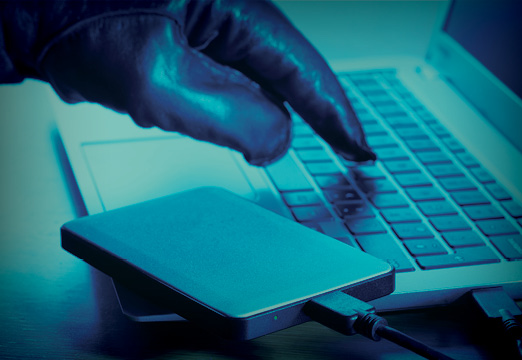 A hacker committing cyber crime