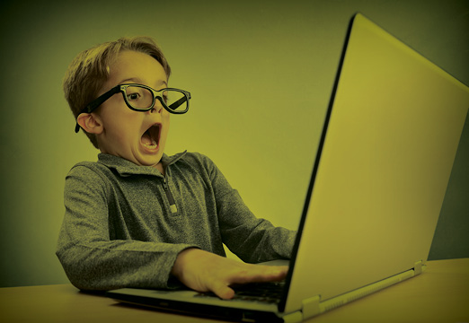 A kid scared of his insurance on his computer