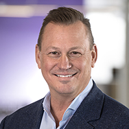 Tom Stewart - a man smiling for a professional headshot photo