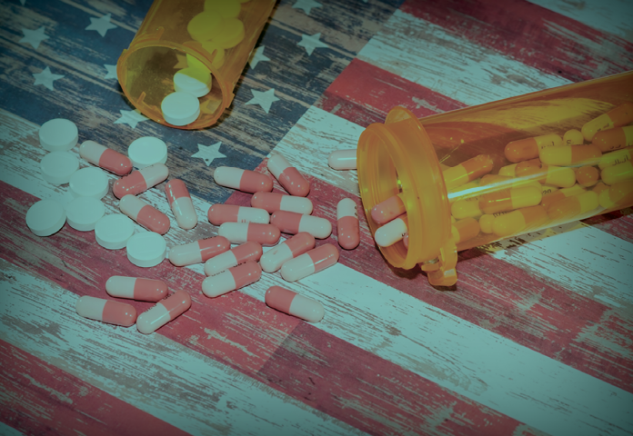 Prescription drugs spilling out onto the American flag