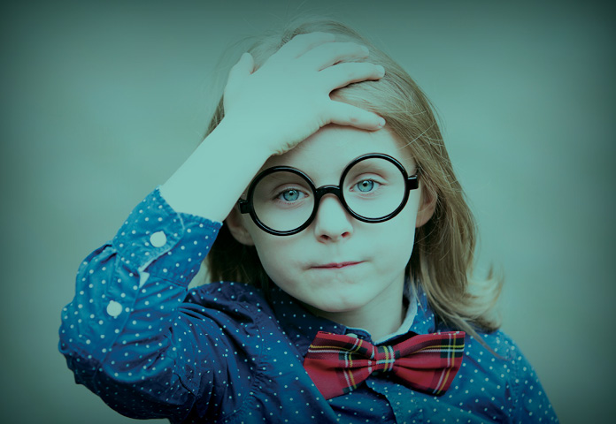 A child holds their head