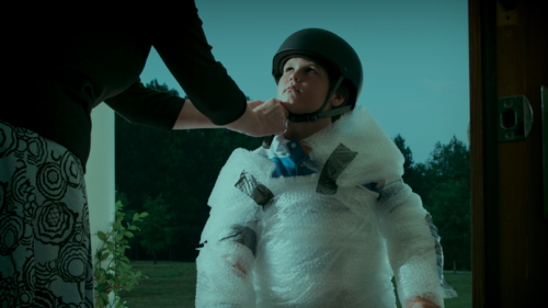 Child being wrapped in bubble wrap