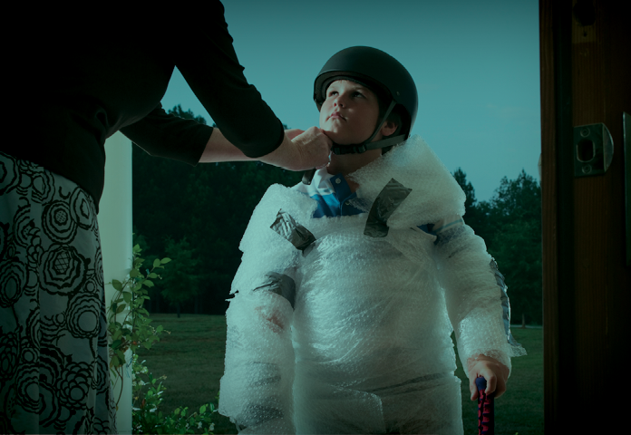 Child being wrapped in bubble wrap