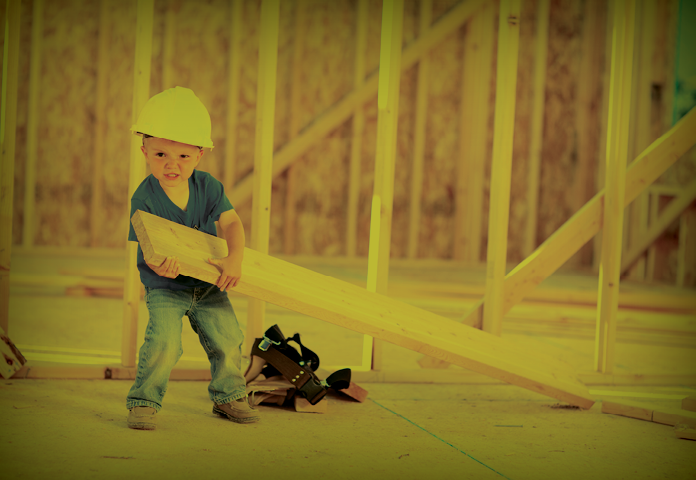 A boy builder helping a construction site