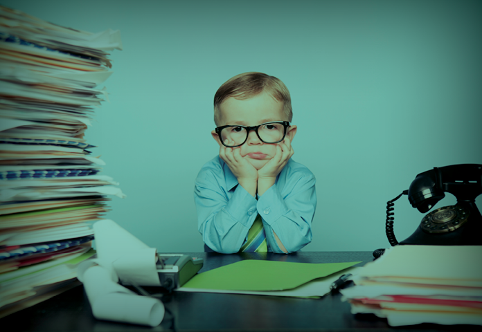 A kid sitting with books of healthcare information
