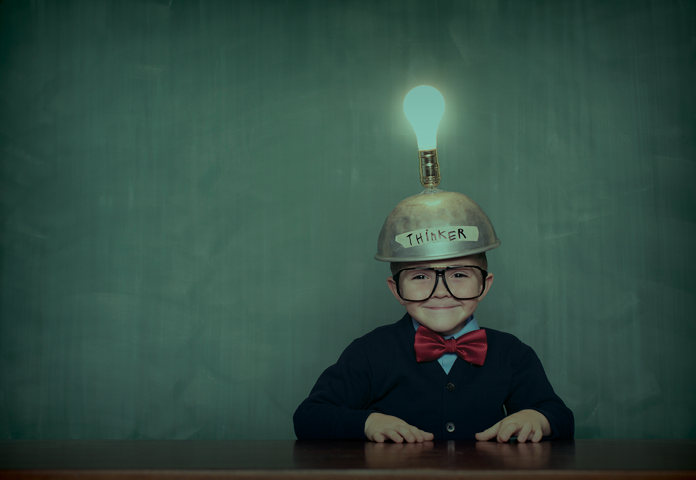 A child wearing a light bulb hat
