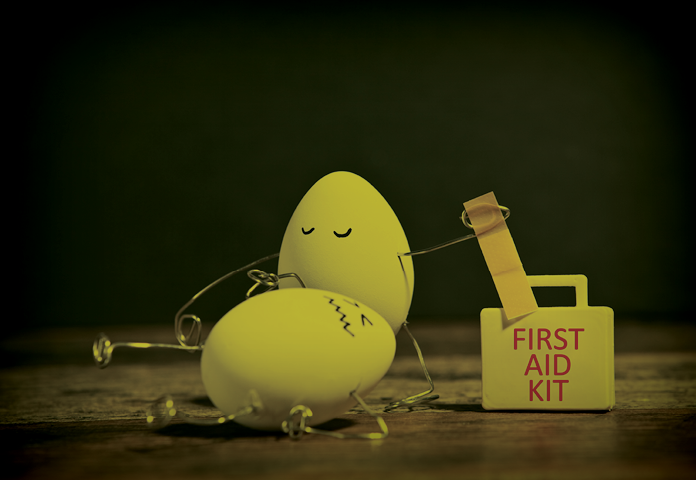 eggs trying to health each other with a first aid kit