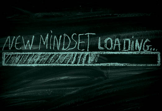 A chalkboard that says New Mindset Loading