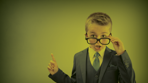 A boy wearing glasses shocked by the cost of insurance