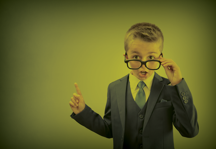 A boy wearing glasses shocked by the cost of insurance