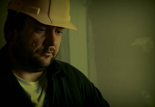 a construction worker thinking about his mental health