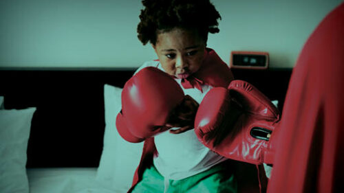 a child pretending to be a boxer and battle healthcare