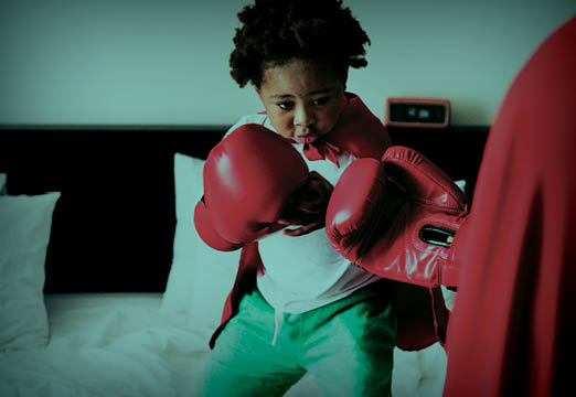 a child pretending to be a boxer and battle healthcare