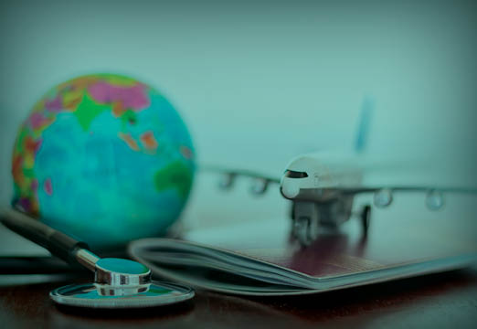 A globe sitting next to an airplane