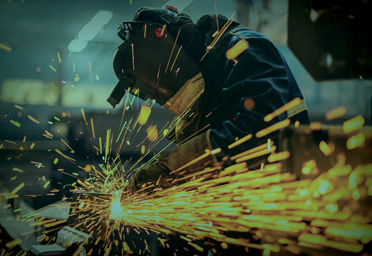 A welder cutting through property casualty insurance