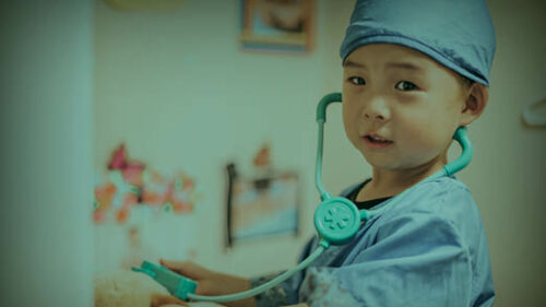 A child dressed up as a healthcare provider