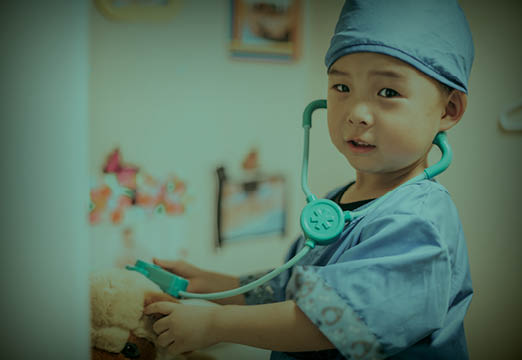 A child dressed up as a healthcare provider