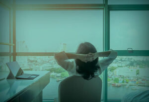 An office worker relaxing in their office