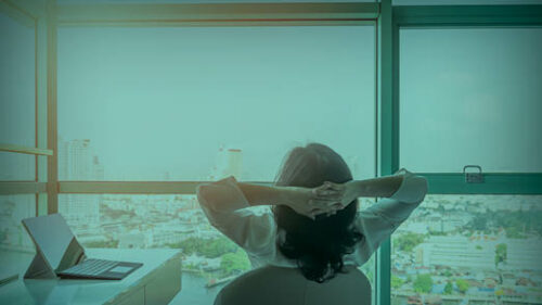 An office worker relaxing in their office