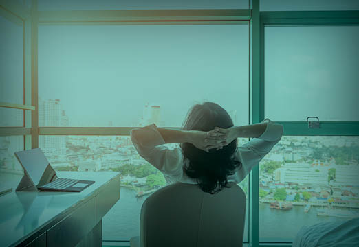 An office worker relaxing in their office