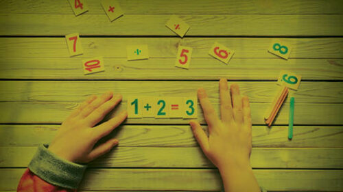 A child using number pieces