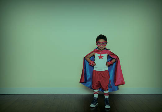 A boy dressed as a super hero