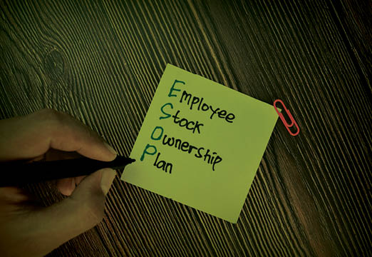 A post it note with ESOP on it