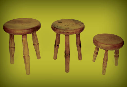 three wooden stools