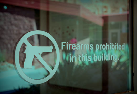 A sign prohibiting firearms