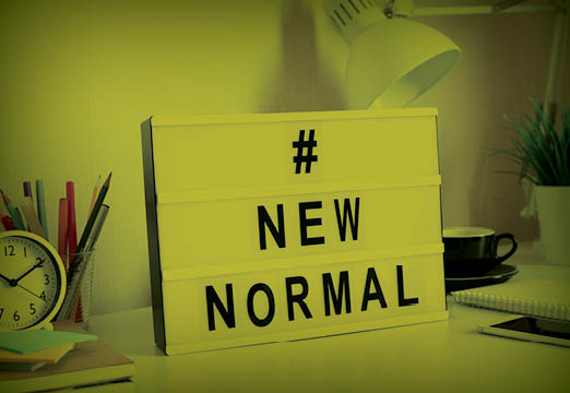 A word board with new normal written on it