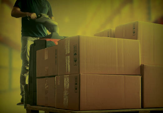 A man moving boxes of supplies
