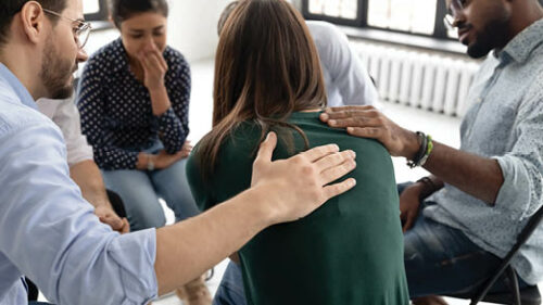 A group of people showing support to an individual