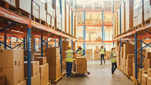 Warehouse with people taking inventory