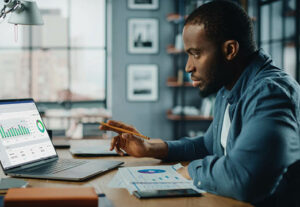 A male employee working from home