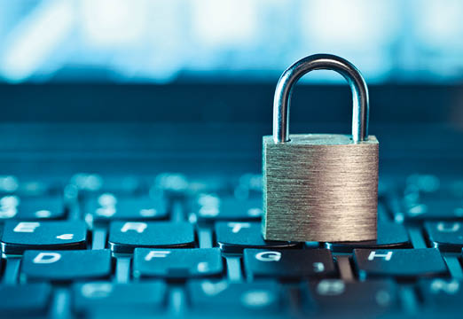 A padlock on a computer keyboard