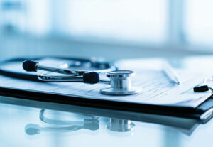 a stethoscope and healthcare papers