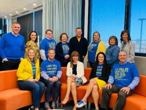 Holmes Murphy leadership wearing blue and yellow with Nataliya Boychenko Stone.