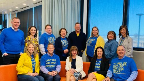 Holmes Murphy leadership wearing blue and yellow with Nataliya Boychenko Stone.