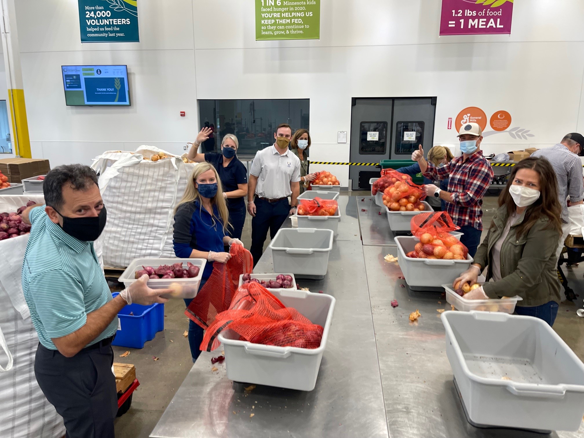 CSDZ team packing meals and volunteering