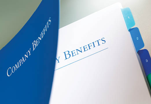 A binder of employee company benefits